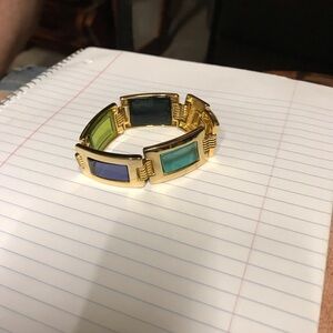 Gold bracelet with multi-colored glass panels